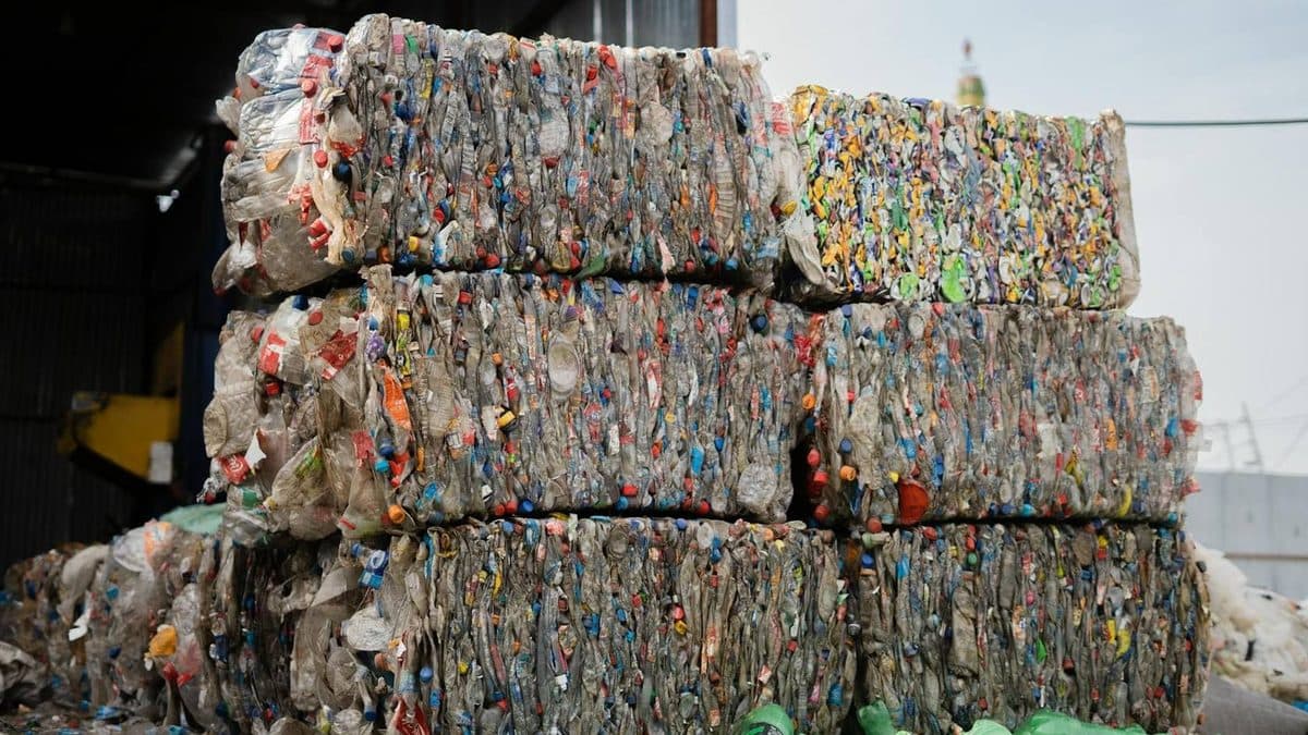 Bales of compressed plastic bottles stacked up, ready for recycling Bales of compressed plastic bottles stacked up, ready for recycling
